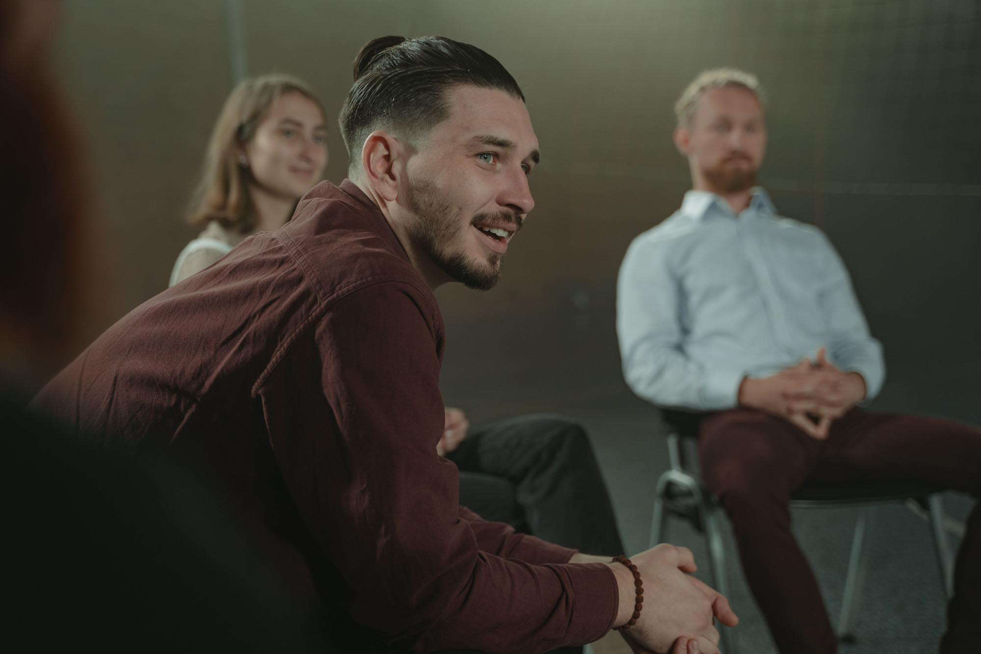 Adult speaking in a group session